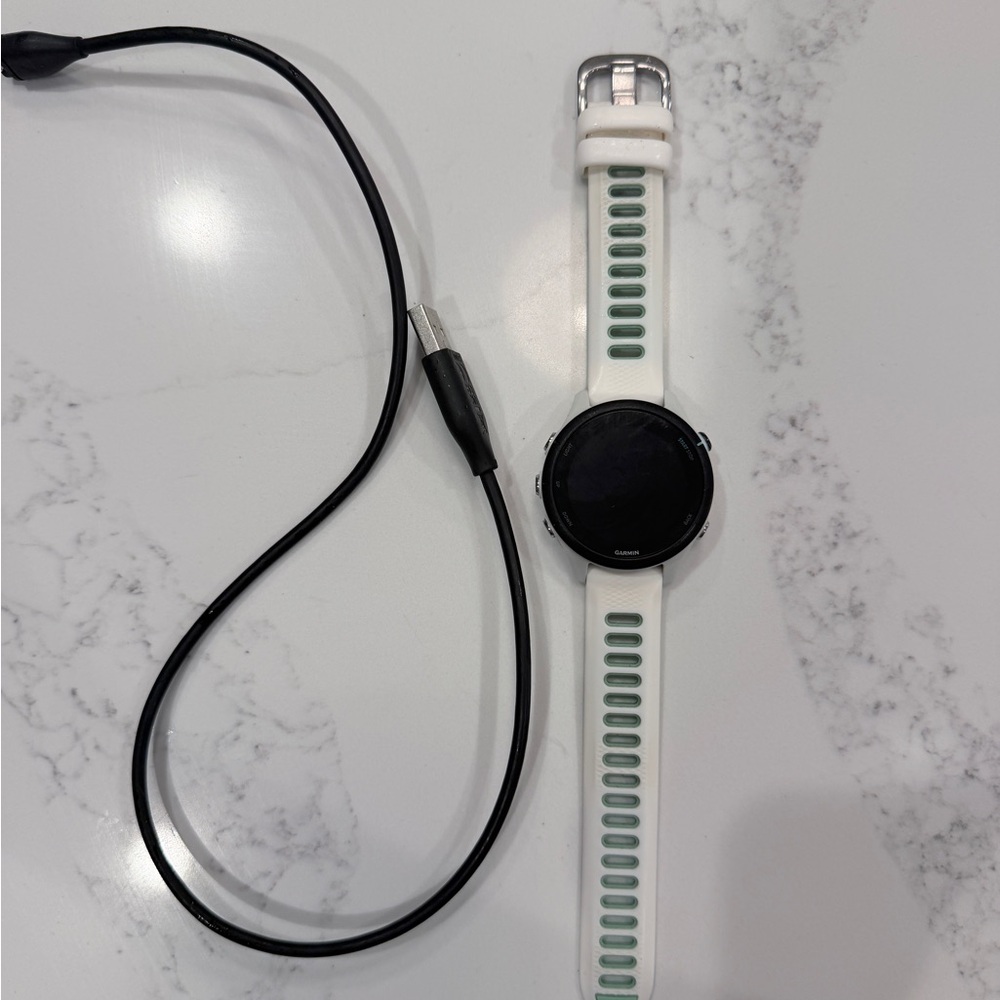 Garmin Smartwatch with White Band and Green Accents